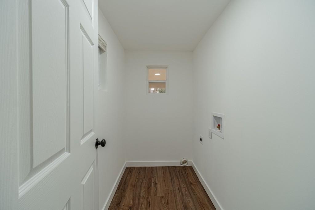 3617 Bob White Lane Southwest Loganville, GA 30052 - Photo 15 of 48 a view of a room with wooden floor and white walls
