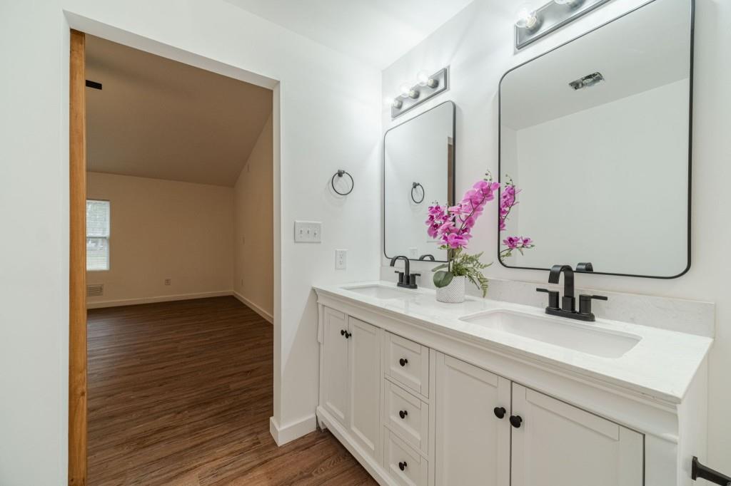 3617 Bob White Lane Southwest Loganville, GA 30052 - Photo 22 of 48 a bathroom with a granite countertop shower sink and mirror