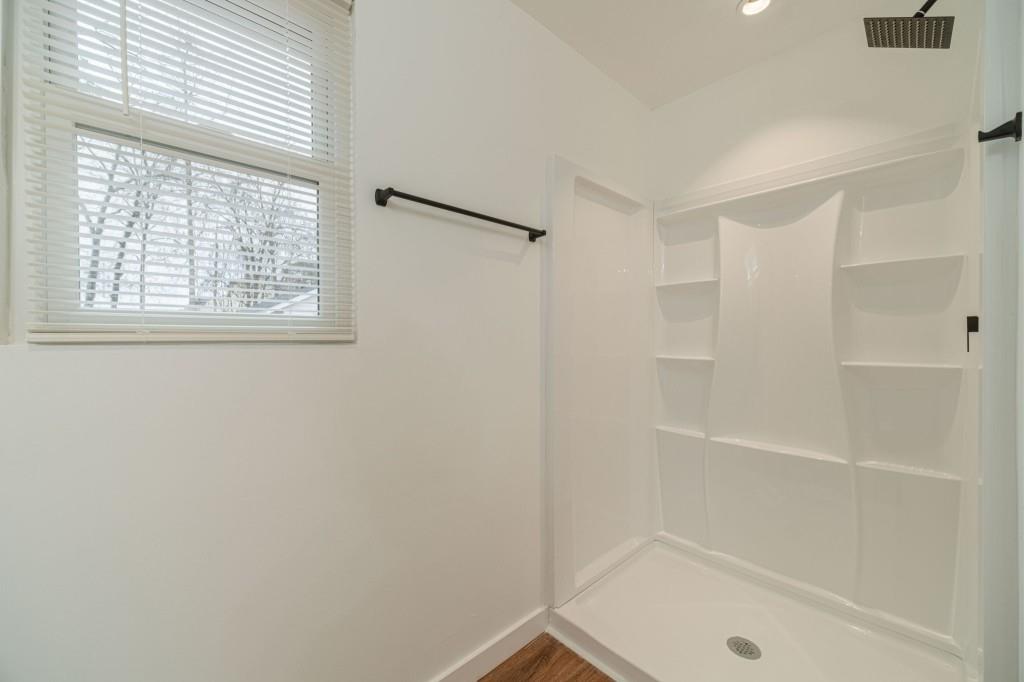 3617 Bob White Lane Southwest Loganville, GA 30052 - Photo 24 of 48 a bathroom with a tub and shower