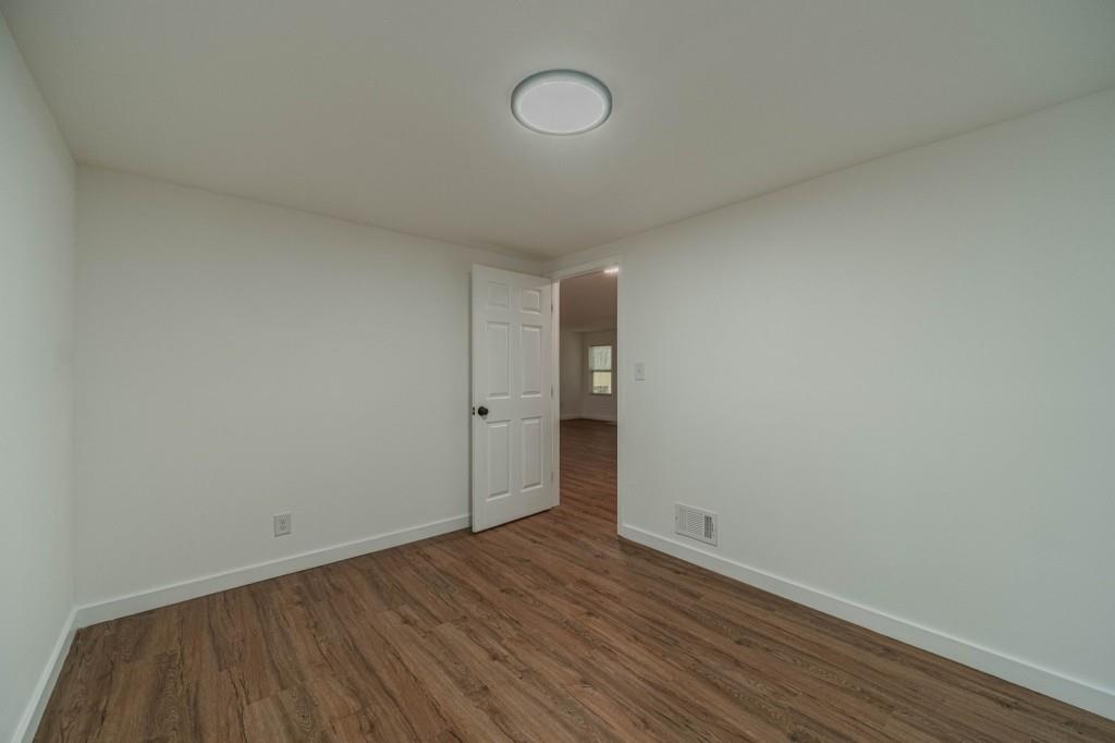 3617 Bob White Lane Southwest Loganville, GA 30052 - Photo 29 of 48 a view of an empty room with wooden floor and fan