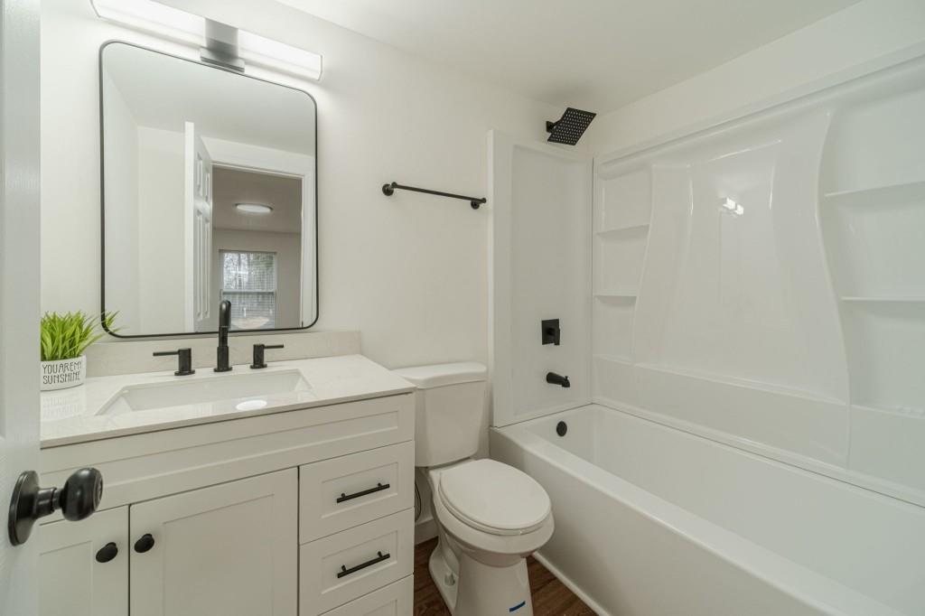 3617 Bob White Lane Southwest Loganville, GA 30052 - Photo 32 of 48 a bathroom with a sink a toilet and shower