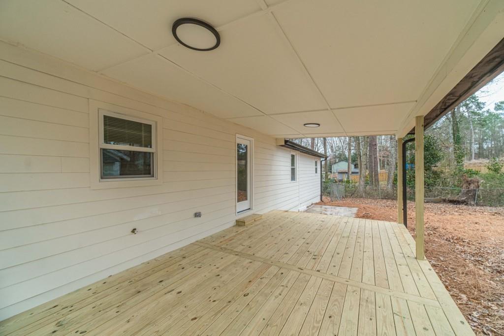 3617 Bob White Lane Southwest Loganville, GA 30052 - Photo 33 of 48 a view of empty room with wooden floor and fan