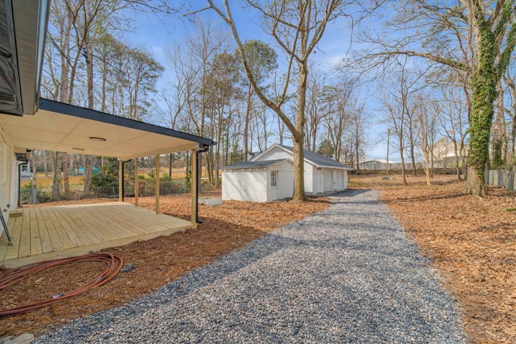 3617 Bob White Lane Southwest Loganville, GA 30052 - Photo 34 of 48 a house with trees in front of it