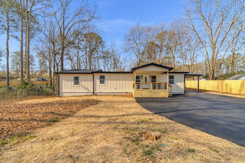 3617 Bob White Lane Southwest Loganville, GA 30052 - Photo 47 of 48 a front view of a house with a yard and garage