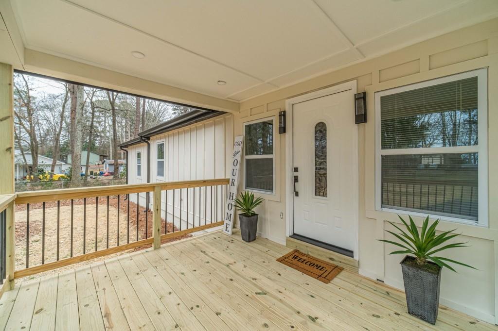 3617 Bob White Lane Southwest Loganville, GA 30052 - Photo 5 of 48 a porch with seating space and balcony