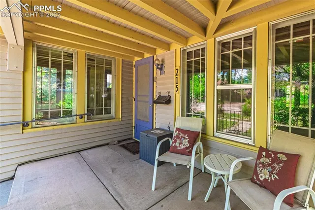 a outdoor living area with furniture and a window