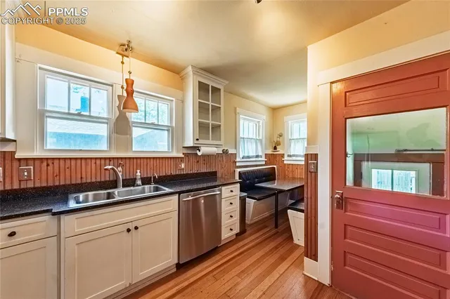 a kitchen with a sink and wooden cabinets