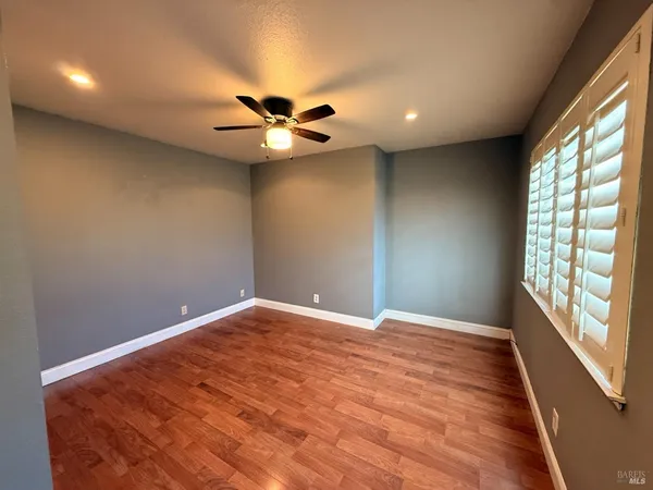 a kitchen with granite countertop stainless steel appliances a refrigerator stove and microwave