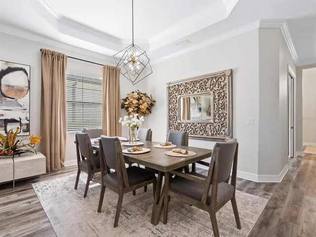 a large kitchen with stainless steel appliances granite countertop a stove refrigerator and cabinets