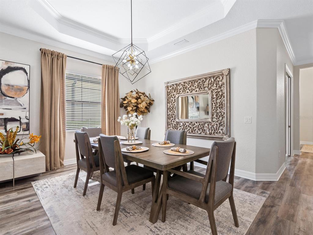 16532 Hillside Circle Lakewood Ranch, FL 34202 - Photo 15 of 67 a view of a dining room with furniture window and outside view