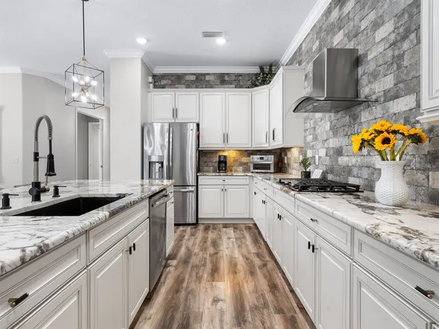 a bedroom with a large bed and a large window