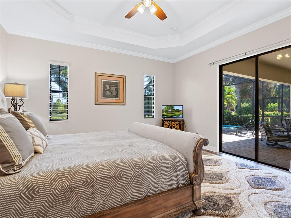 16532 Hillside Circle Lakewood Ranch, FL 34202 - Photo 23 of 67 a bedroom with a large bed and a large window