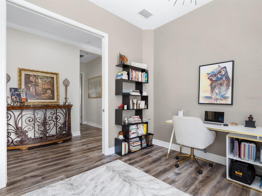 16532 Hillside Circle Lakewood Ranch, FL 34202 - Photo 25 of 67 a workspace with furniture and book shelf