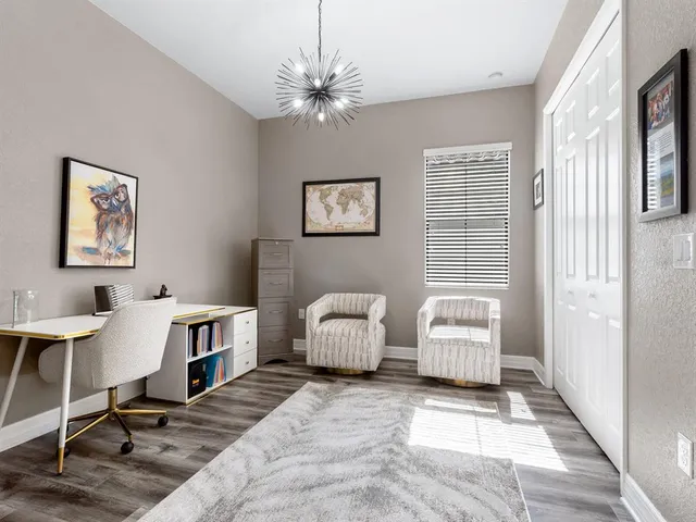 a view of a workspace with a bookshelf