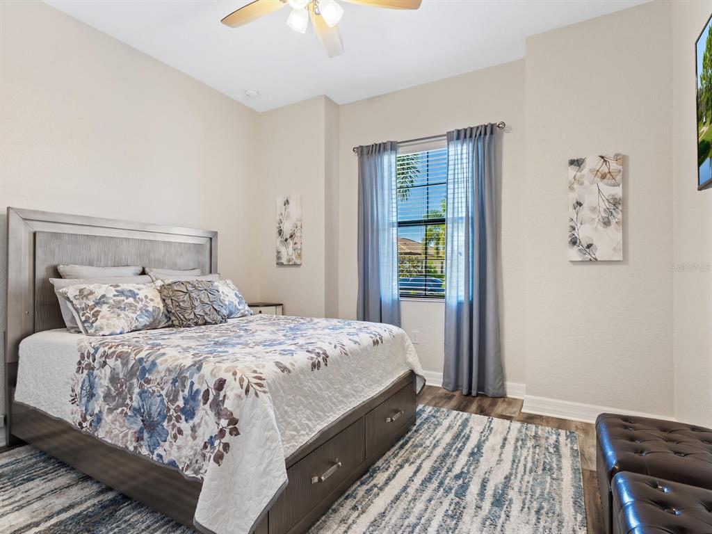 16532 Hillside Circle Lakewood Ranch, FL 34202 - Photo 29 of 67 a bedroom with a large bed and a window