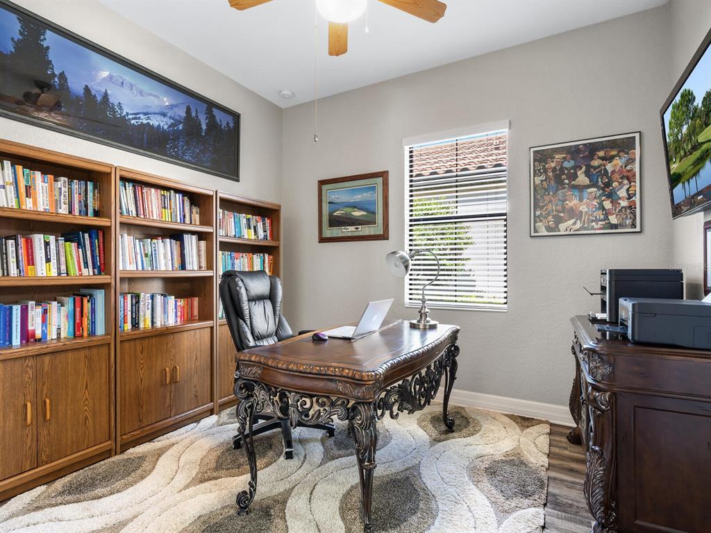 16532 Hillside Circle Lakewood Ranch, FL 34202 - Photo 30 of 67 a view of a workspace with a bookshelf