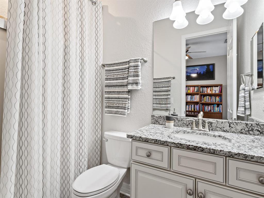 16532 Hillside Circle Lakewood Ranch, FL 34202 - Photo 32 of 67 a bathroom with a granite countertop sink toilet and shower