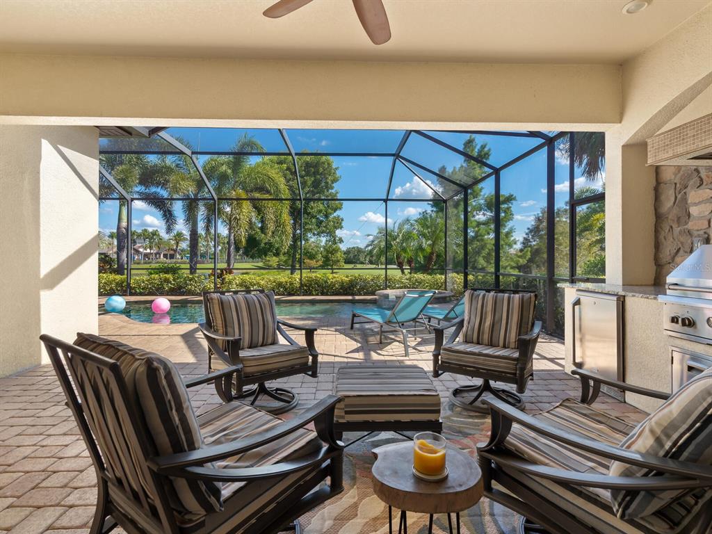 16532 Hillside Circle Lakewood Ranch, FL 34202 - Photo 34 of 67 a view of a patio with couches table and chairs