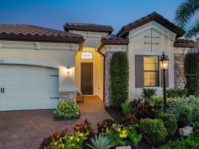 an aerial view of a house with a ocean view