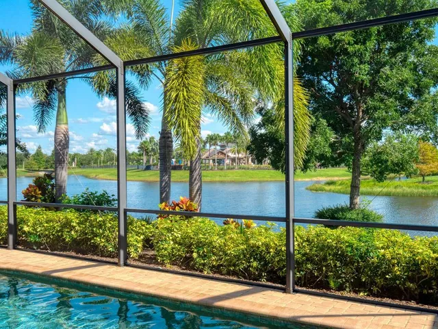 an aerial view of a house with a garden and swimming pool