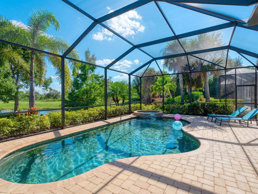 16532 Hillside Circle Lakewood Ranch, FL 34202 - Photo 43 of 67 a view of a backyard with a garden and plants