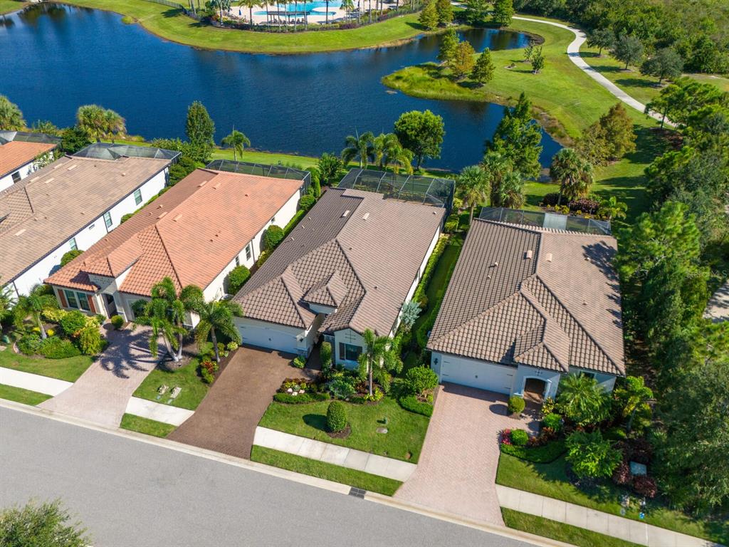 16532 Hillside Circle Lakewood Ranch, FL 34202 - Photo 49 of 67 an aerial view of a house with a garden and swimming pool