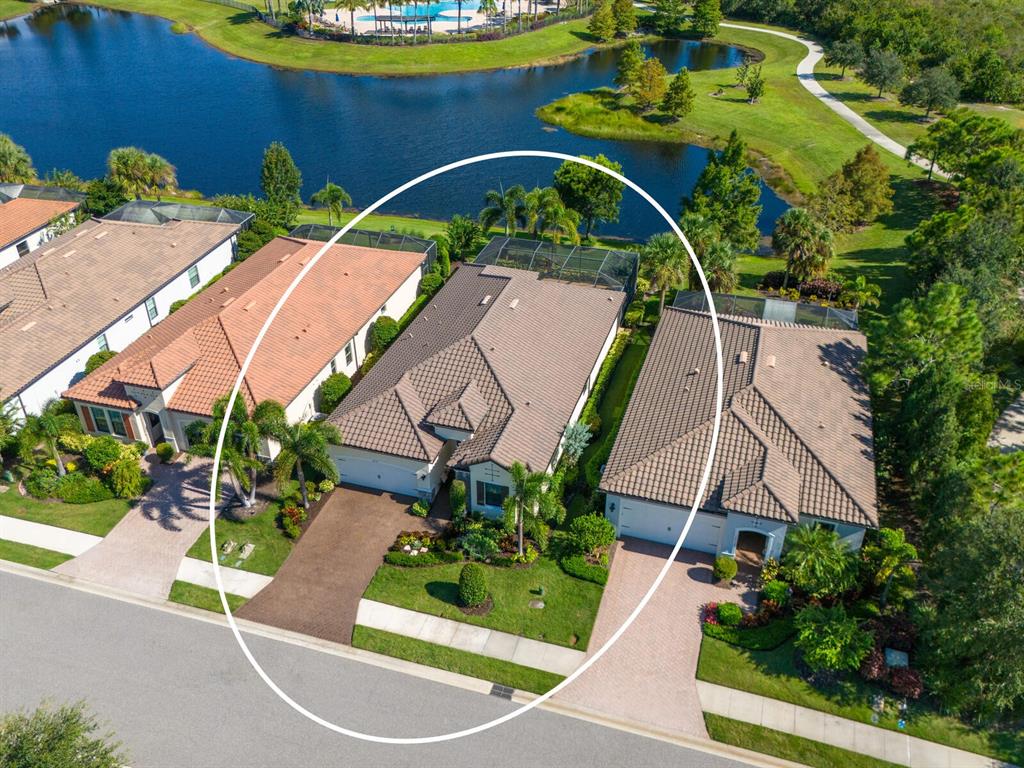 16532 Hillside Circle Lakewood Ranch, FL 34202 - Photo 7 of 67 an aerial view of a house with a yard and potted plants