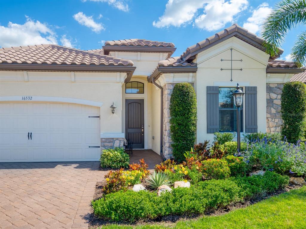 16532 Hillside Circle Lakewood Ranch, FL 34202 - Photo 8 of 67 a front view of a house with garden