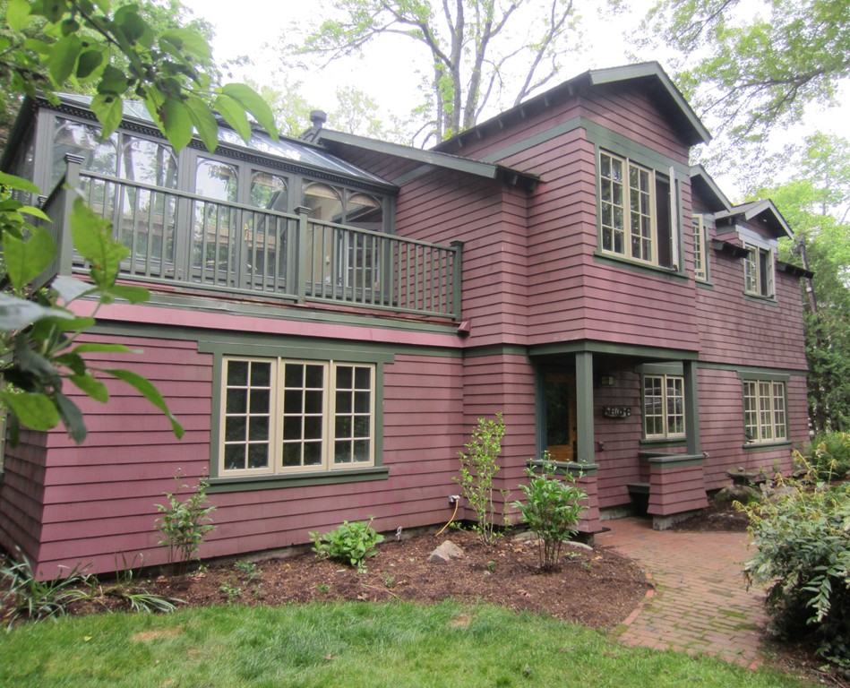 9 West Riding Street Wellesley, MA 02482 - Photo 12 of 16 a front view of a house with a garden