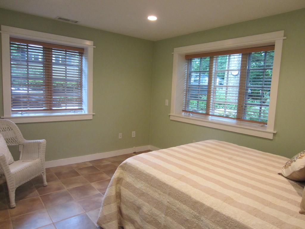 9 West Riding Street Wellesley, MA 02482 - Photo 2 of 16 a bedroom with a bed and a window