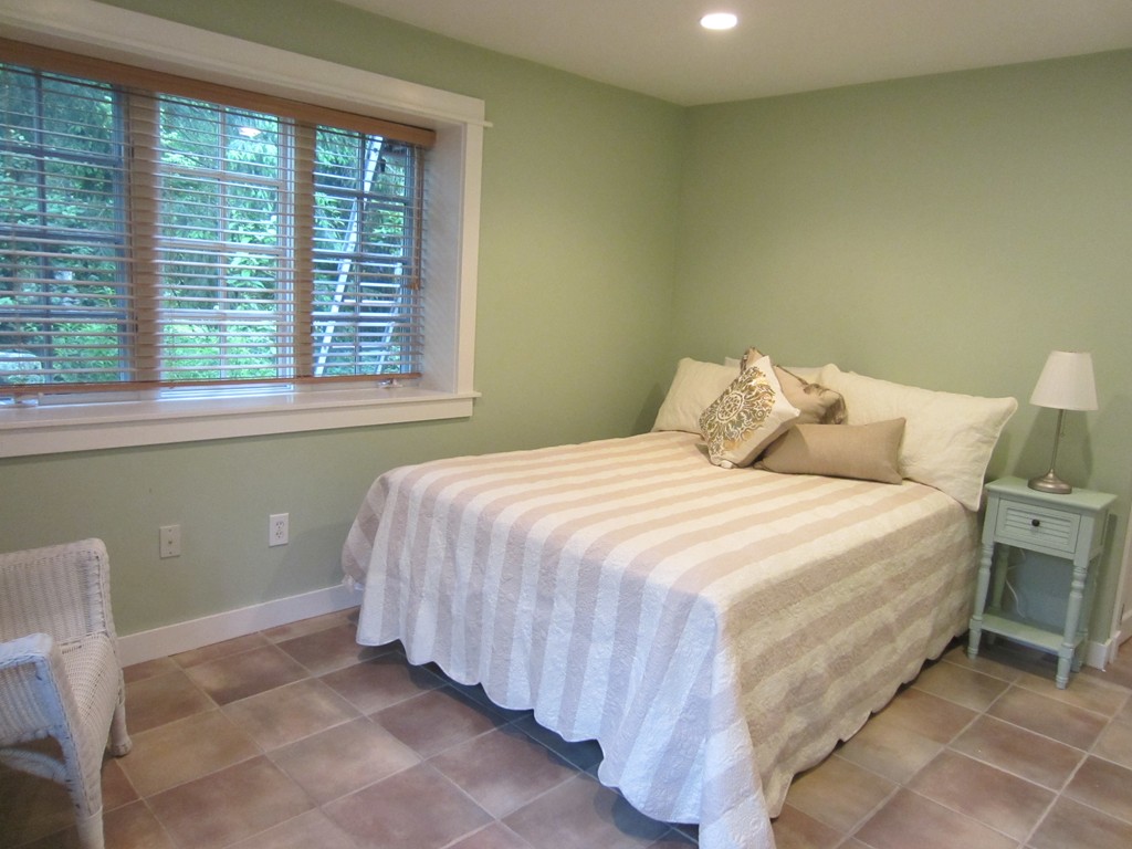 9 West Riding Street Wellesley, MA 02482 - Photo 3 of 16 a bedroom with a bed and a window