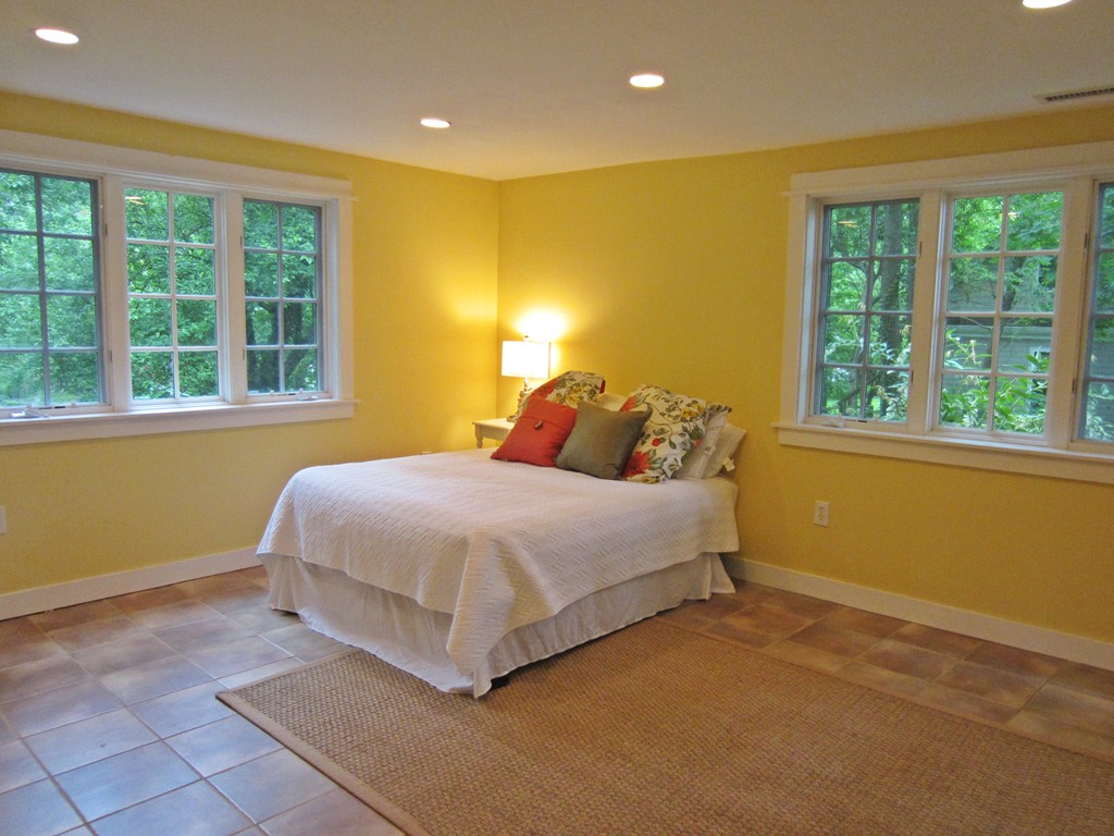 9 West Riding Street Wellesley, MA 02482 - Photo 4 of 16 a bedroom with a bed and a window