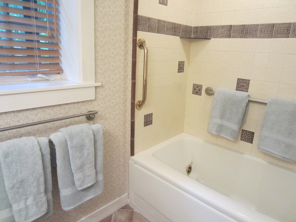 9 West Riding Street Wellesley, MA 02482 - Photo 6 of 16 a bathroom with a bathtub and a shower