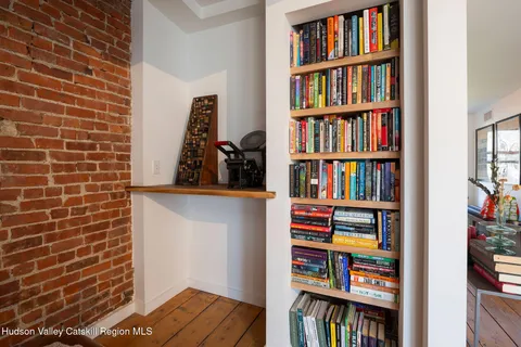 a bookshelf with wooden floor and book shelf