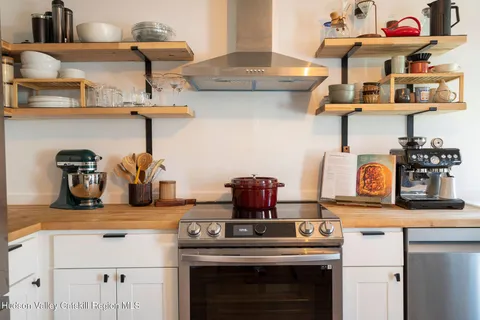 a kitchen with a stove and cabinets