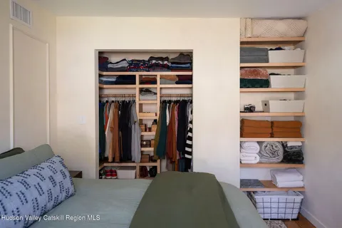 a bedroom with furniture and a window