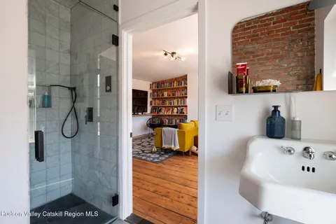a bathroom with a bathtub and a shower
