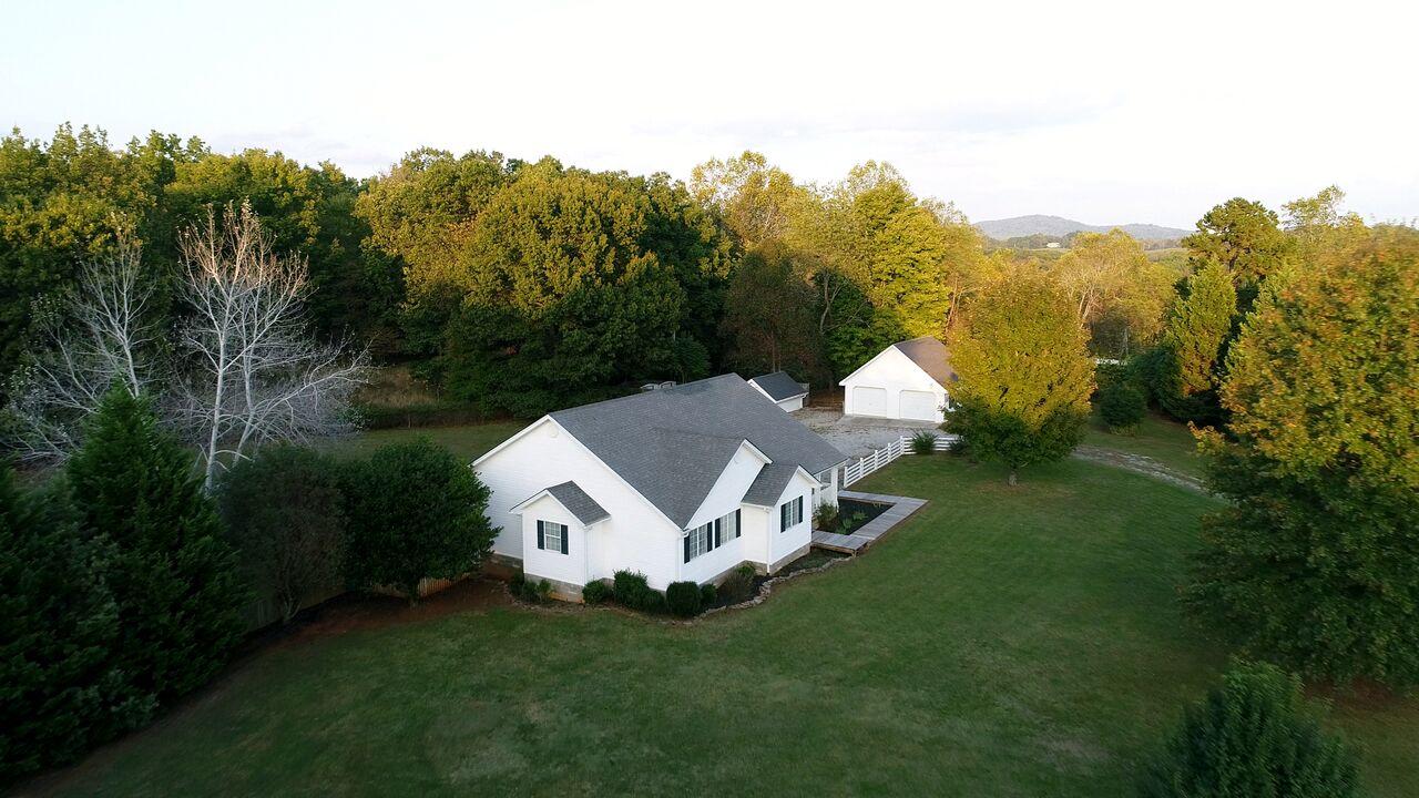 1650 Dickerson Road Goodview, VA 24095 - Photo 2 of 30 a view of a house with a backyard and trees