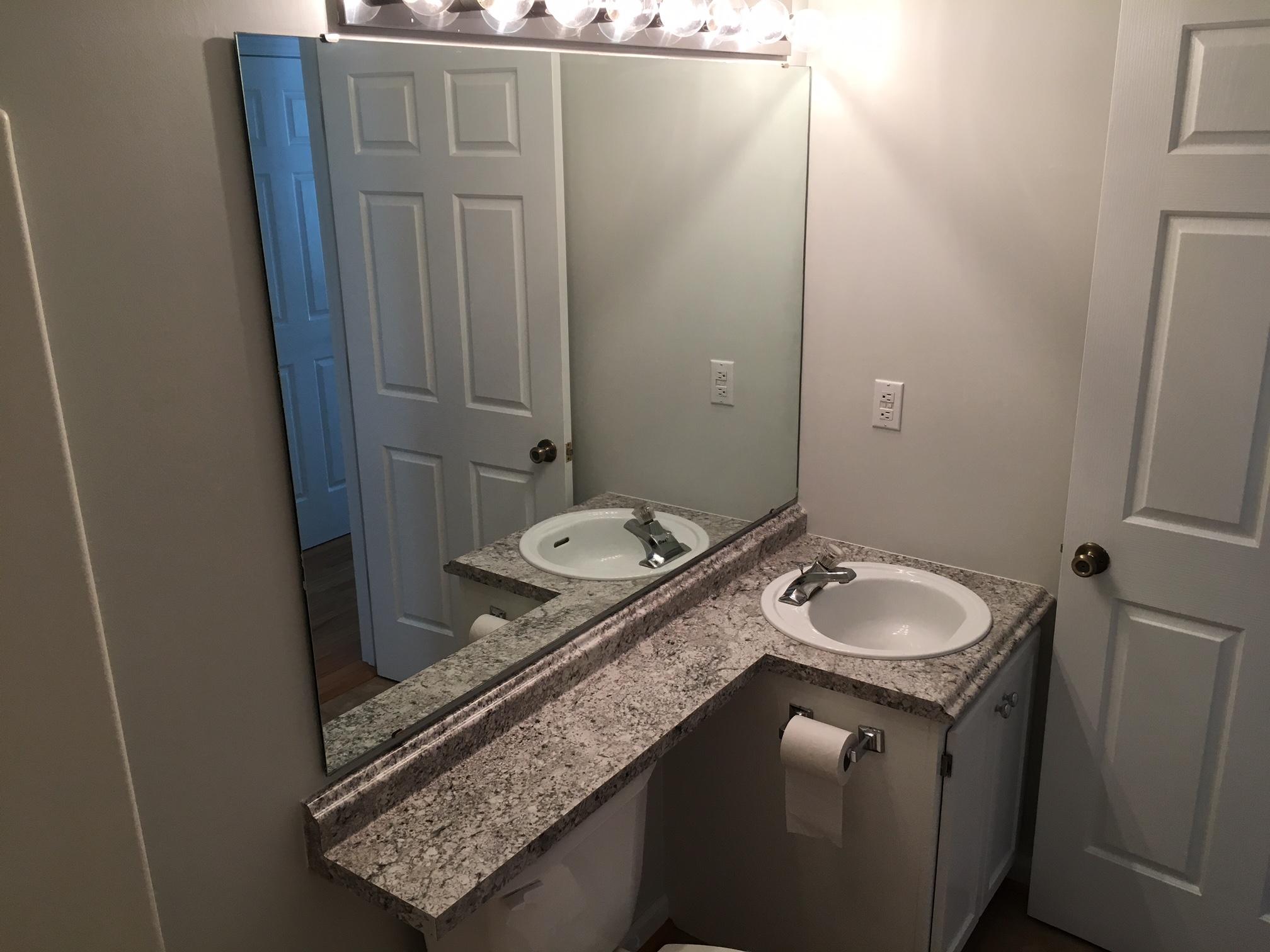 1650 Dickerson Road Goodview, VA 24095 - Photo 11 of 30 a bathroom with a granite countertop sink and a mirror