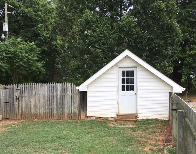 1650 Dickerson Road Goodview, VA 24095 - Photo 30 of 30 a view of a backyard with plants and large trees