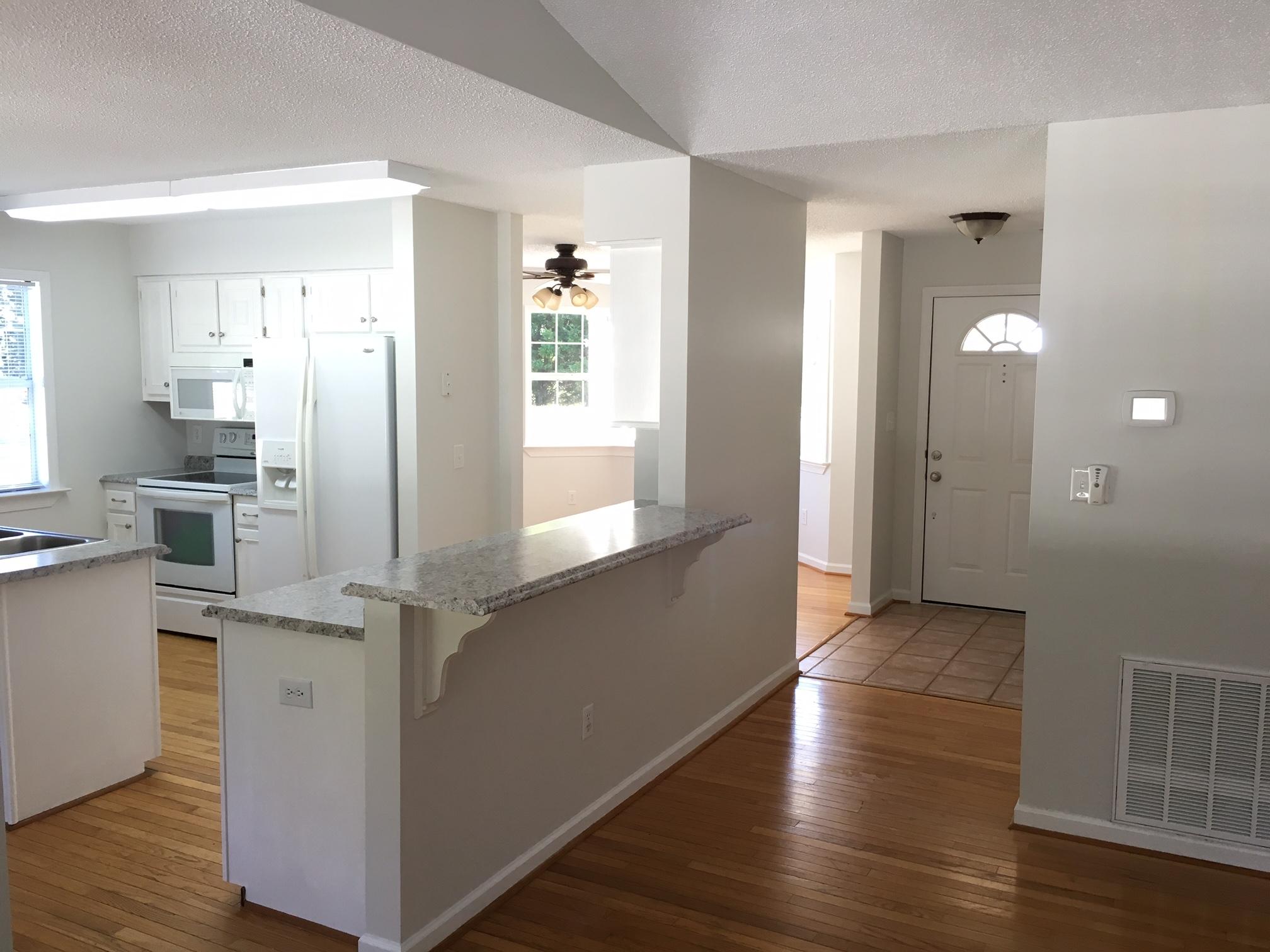 1650 Dickerson Road Goodview, VA 24095 - Photo 5 of 30 an empty room with wooden floor and windows