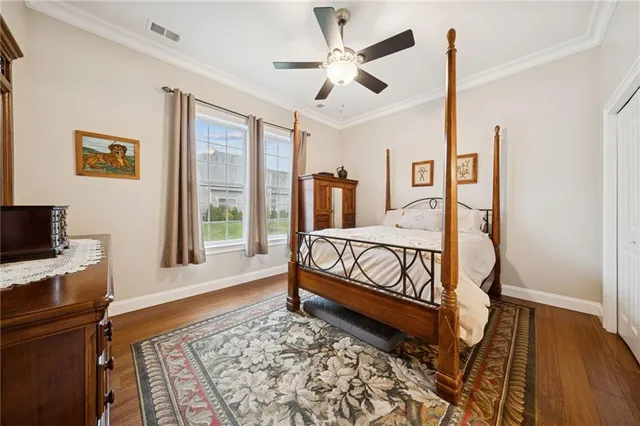 a bedroom with furniture and a window