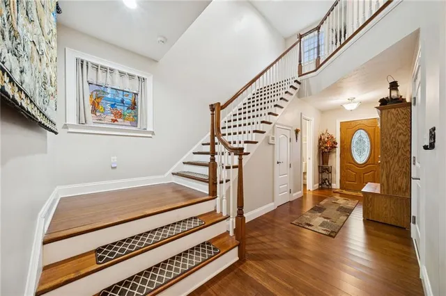 a view of an entryway with wooden floor