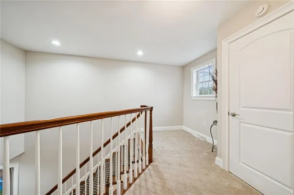 a view of an entryway with wooden floor