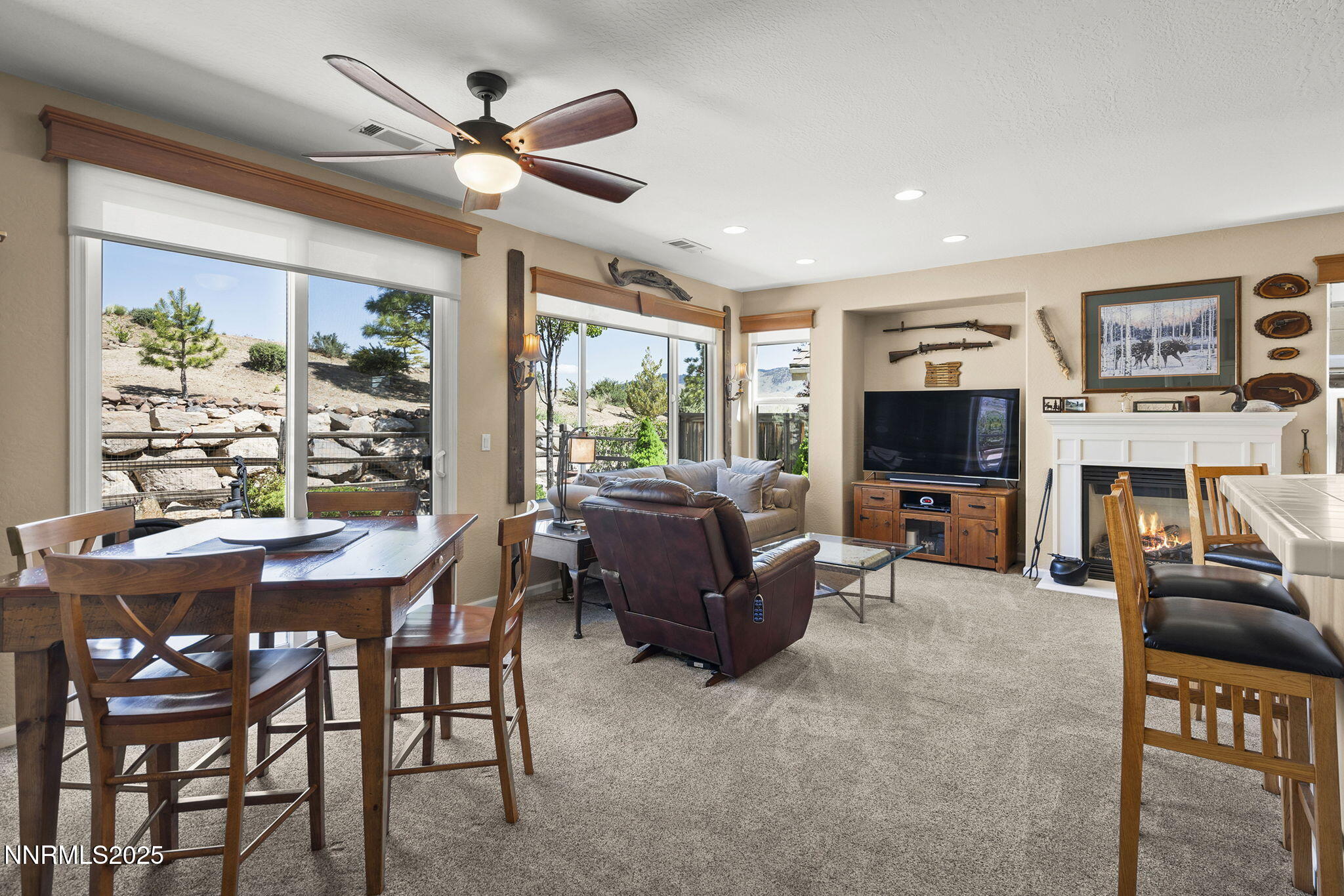 1258 Firefly Court Reno, NV 89523 - Photo 8 of 51 a living room with furniture a flat screen tv and a large window