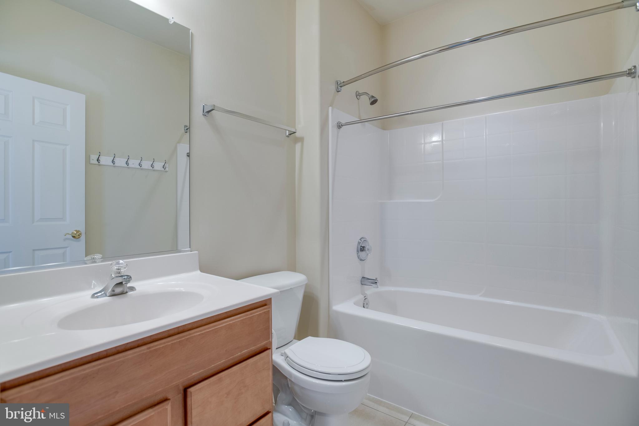 14308 South Hall Court Culpeper, VA 22701 - Photo 35 of 78 a bathroom with a sink toilet and shower
