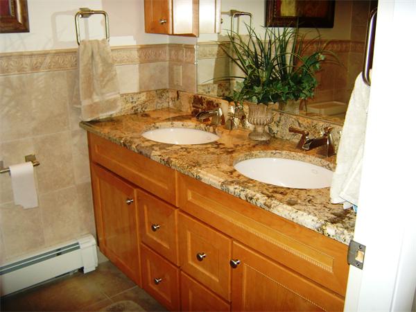 2 Mohawk Road Canton, MA 02021 - Photo 4 of 6 a bathroom with a granite countertop sink a mirror and a shower