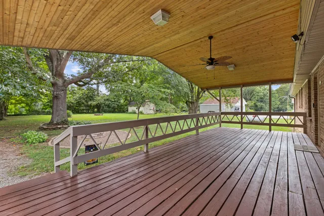 a view of balcony with wooden floor