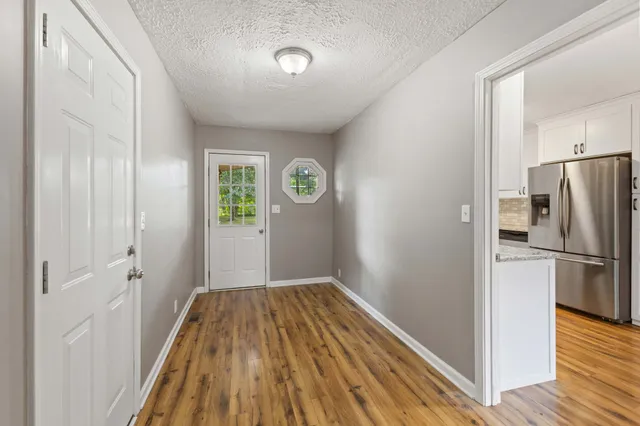 a view of a hardwood floor in a kitchen