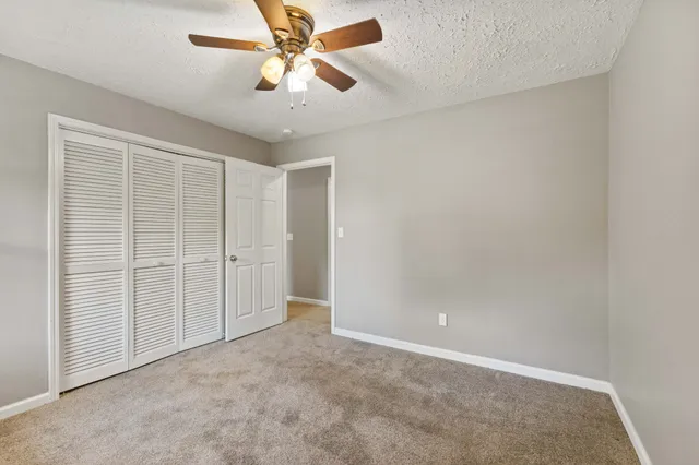 an empty room with closet area